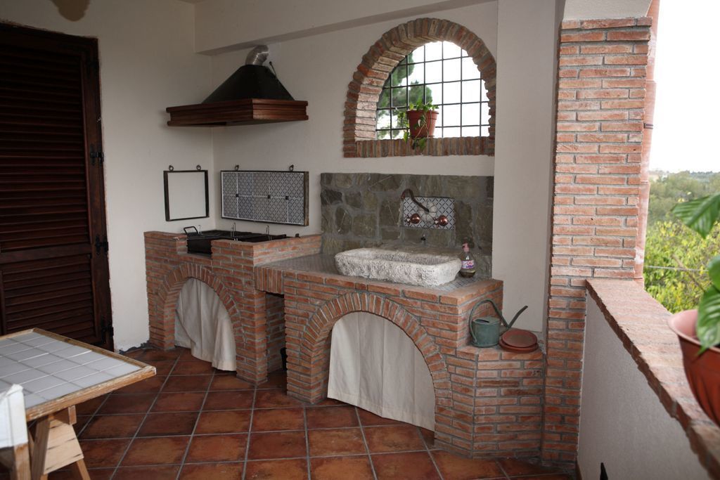 Restauro di un casolare di fine 800, Studio di Progettazione Arch. Tiziana Franchina Studio di Progettazione Arch. Tiziana Franchina Rustic style garden Fire pits & barbecues